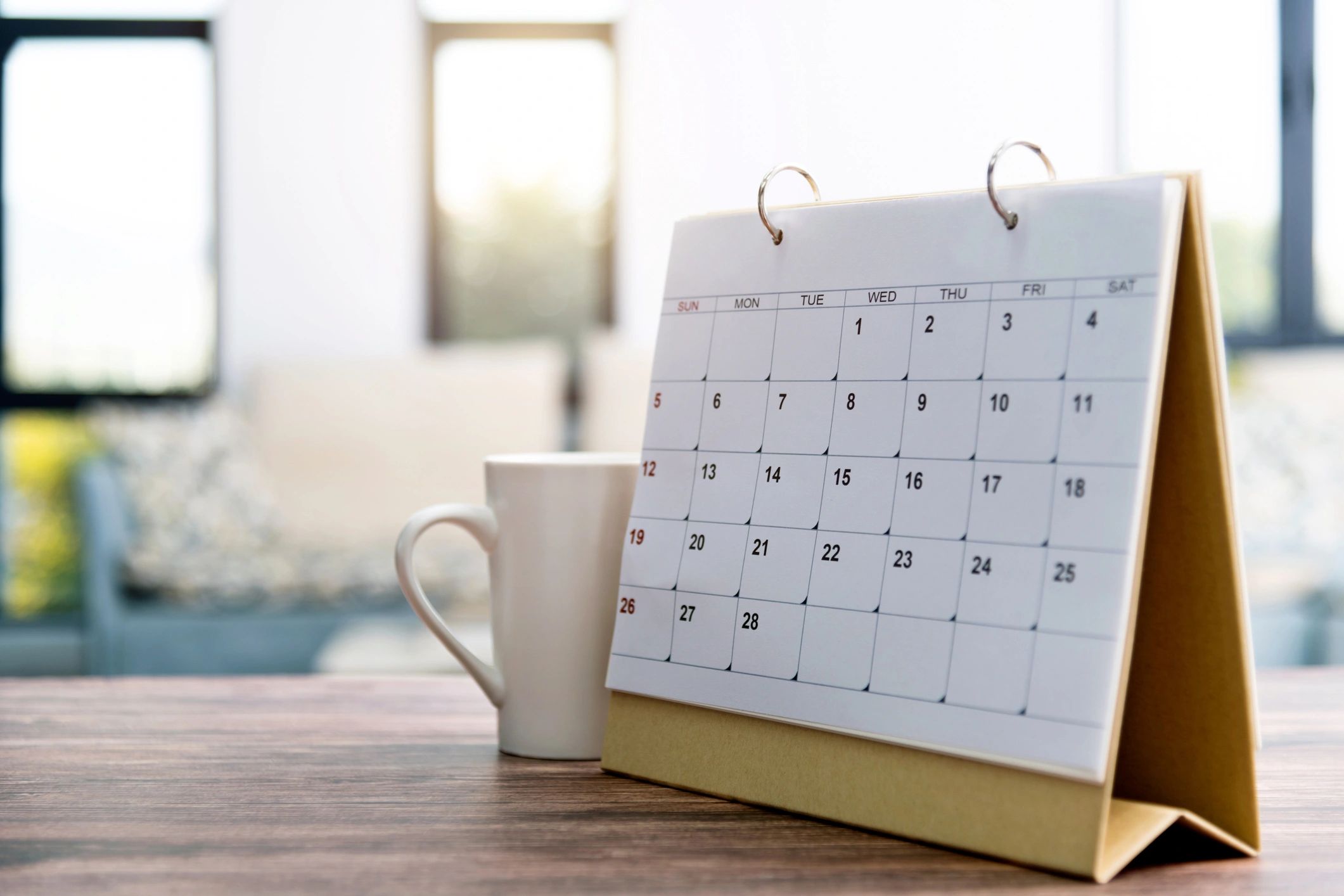 Elegant calendar and coffee on a table
